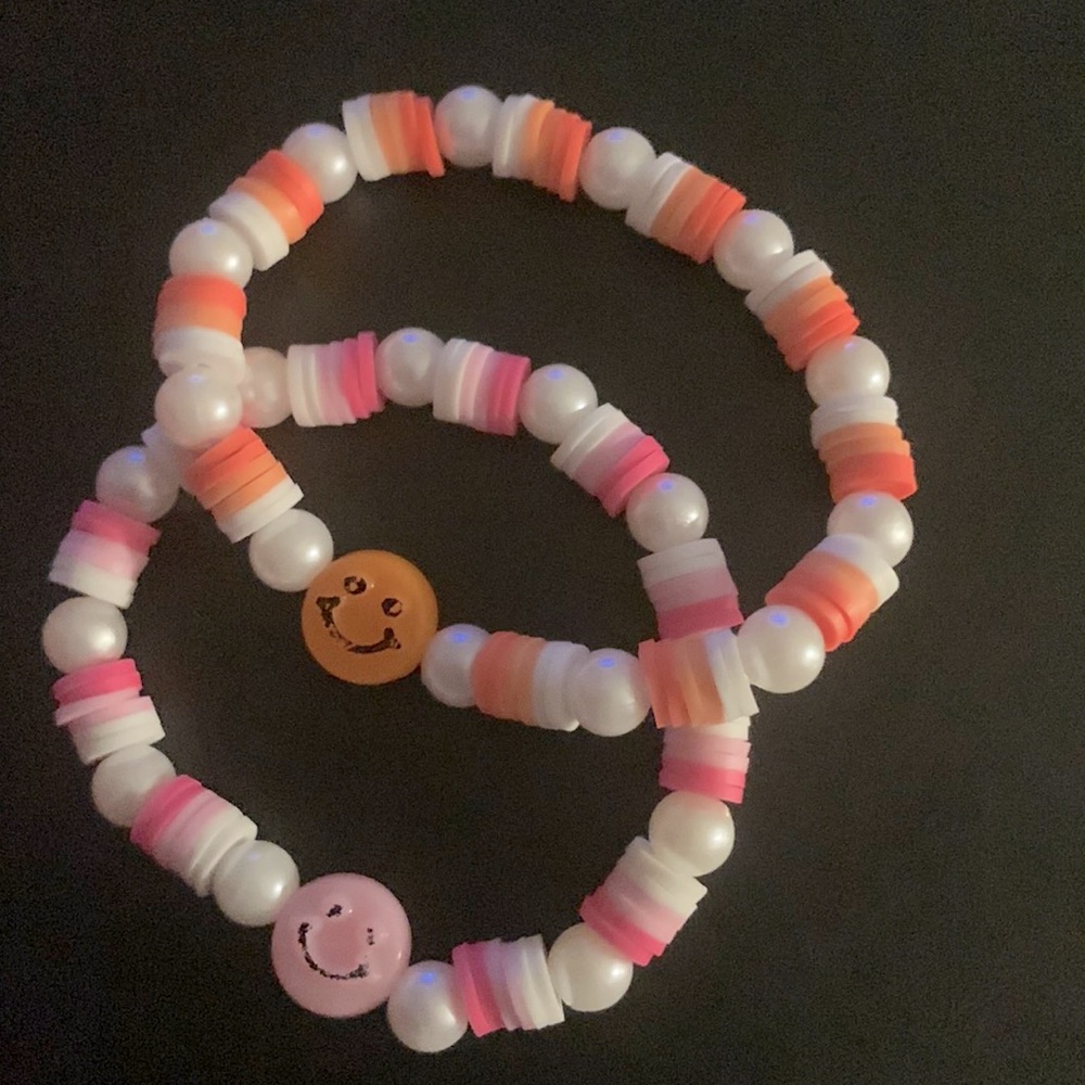 Pink and Orange smiley face bracelets